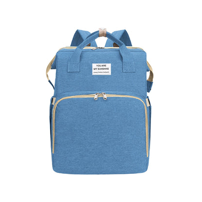 Baby diaper backpack with changing station